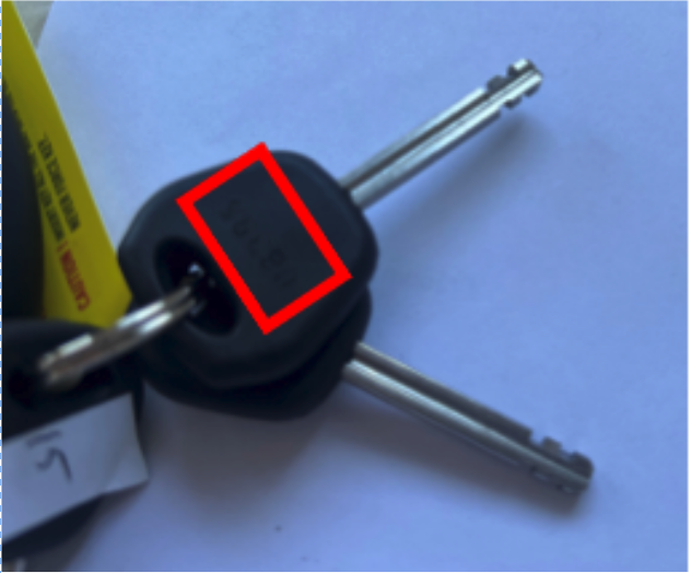 On the plastic head of the key